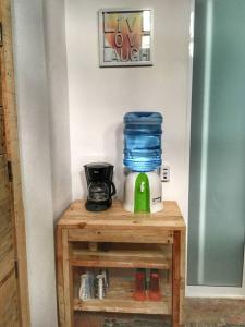 a table with a coffee maker and a blender on it at Apartamento Areca # in Sayulita