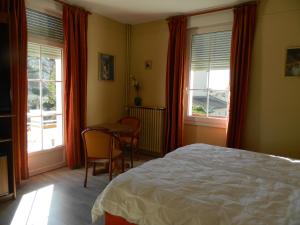 Postel nebo postele na pokoji v ubytování Hôtel La Caravelle
