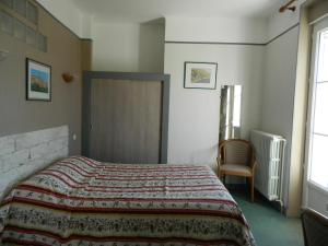 Postel nebo postele na pokoji v ubytování Hôtel La Caravelle