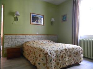 Postel nebo postele na pokoji v ubytování Hôtel La Caravelle