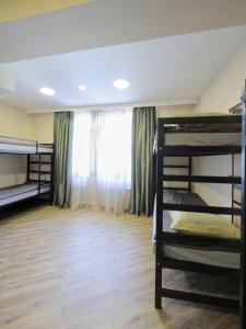 Postel nebo postele na pokoji v ubytování Highland Hostel
