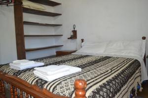 Säng eller sängar i ett rum på Cabañas Los Relinchos