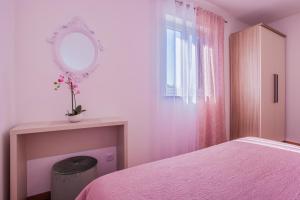 Postel nebo postele na pokoji v ubytování Apartman Madlen