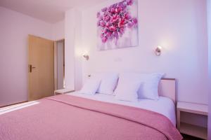Postel nebo postele na pokoji v ubytování Apartman Madlen