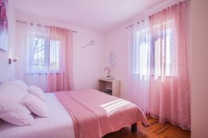 Postel nebo postele na pokoji v ubytování Apartman Madlen