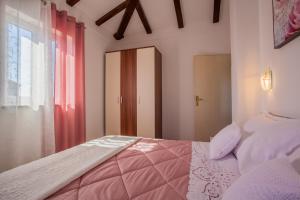 Postel nebo postele na pokoji v ubytování Apartman Madlen