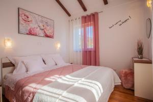 Postel nebo postele na pokoji v ubytování Apartman Madlen