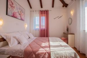 Postel nebo postele na pokoji v ubytování Apartman Madlen