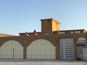 a man standing on the top of a building at Galaxy VIP in Salalah