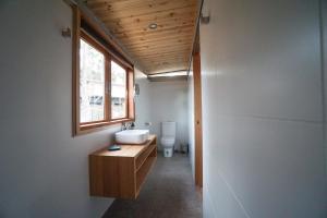 a bathroom with a sink and a toilet at Free Spirit Pods in Barnes Bay +37 photos