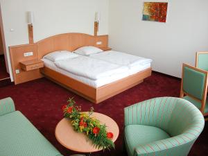 Säng eller sängar i ett rum på Gasthof Hensle