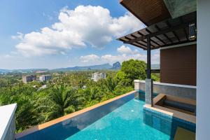 a house with a swimming pool with a view at Andakiri Pool Villa Panoramic Sea View in Ao Nang Beach