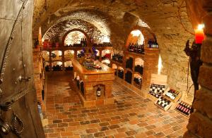 a wine cellar with a bar in a stone building at Gasthof Hensle in Sankt Gallen