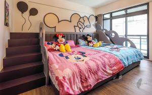 Cama ou camas em um quarto em Wujie Childlike B&B