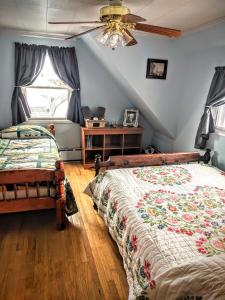 a bedroom with two beds and a window at Three Bears Inn in Saint Anthony