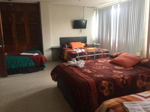 Posteľ alebo postele v izbe v ubytovaní G y V Hotels