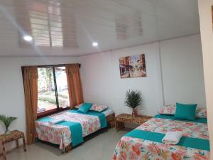 Postel nebo postele na pokoji v ubytování Hotel Maguey
