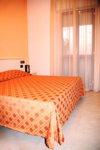 Cama o camas de una habitación en Hotel Leon D'Oro