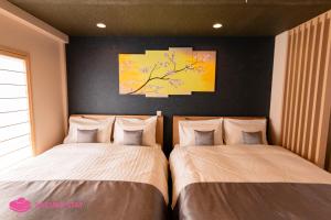 Кровать или кровати в номере Sakura Stay Yoga 201