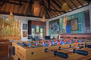 a room with a table with a group of figurines at Salim Beach Resort in Gili Air