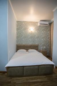 Voodi või voodid majutusasutuse Nork Boutique Hotel toas