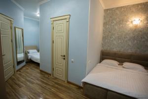 Voodi või voodid majutusasutuse Nork Boutique Hotel toas