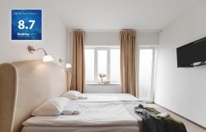 Postel nebo postele na pokoji v ubytování Happy Inn