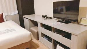 TV a/nebo společenská místnost v ubytování Sakura Terrace