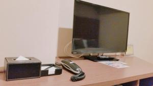 TV a/nebo společenská místnost v ubytování Sakura Terrace