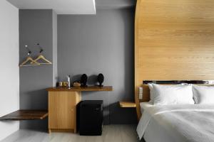 Ein Bett oder Betten in einem Zimmer der Unterkunft 墾丁宜庭海景親子民宿
