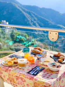 a table with breakfast food on it with a view at Hotel Bonadies in Ravello