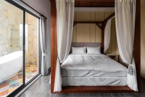Ein Bett oder Betten in einem Zimmer der Unterkunft 墾丁宜庭海景親子民宿