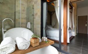 Ein Bett oder Betten in einem Zimmer der Unterkunft 墾丁宜庭海景親子民宿