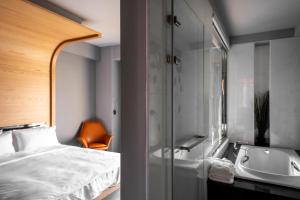 Ein Bett oder Betten in einem Zimmer der Unterkunft 墾丁宜庭海景親子民宿