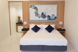 Postel nebo postele na pokoji v ubytování Raya Buri Resort Kanchanaburi