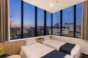 Postel nebo postele na pokoji v ubytování hotel MONday Premium TOYOSU