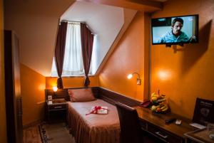 Μια τηλεόραση ή/και κέντρο ψυχαγωγίας στο Guesthouse Villa Modex