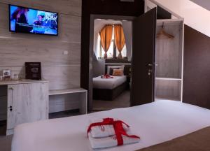 Ένα ή περισσότερα κρεβάτια σε δωμάτιο στο Guesthouse Villa Modex