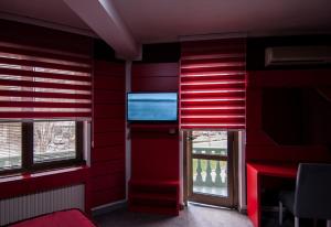 Μια τηλεόραση ή/και κέντρο ψυχαγωγίας στο Guesthouse Villa Modex