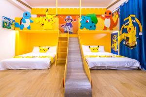 Postelja oz. postelje v sobi nastanitve 松楓親子民宿Songfeng Family B&B