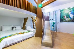 Postelja oz. postelje v sobi nastanitve 松楓親子民宿Songfeng Family B&B
