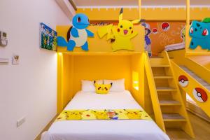 Postelja oz. postelje v sobi nastanitve 松楓親子民宿Songfeng Family B&B