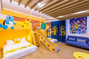 Postelja oz. postelje v sobi nastanitve 松楓親子民宿Songfeng Family B&B