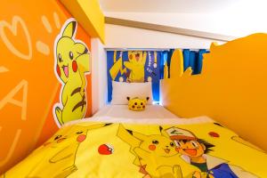Postelja oz. postelje v sobi nastanitve 松楓親子民宿Songfeng Family B&B