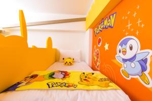 Postelja oz. postelje v sobi nastanitve 松楓親子民宿Songfeng Family B&B