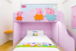Postelja oz. postelje v sobi nastanitve 松楓親子民宿Songfeng Family B&B
