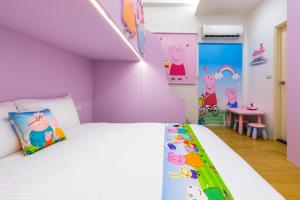 Postelja oz. postelje v sobi nastanitve 松楓親子民宿Songfeng Family B&B