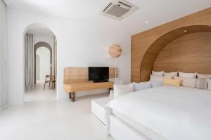 SALA Samui Chaweng Beach Resort客房内的一张或多张床位