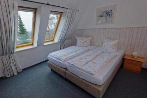 Postel nebo postele na pokoji v ubytování Pension Am Kirschberg