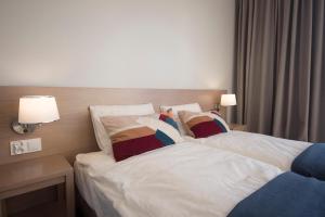 Posteľ alebo postele v izbe v ubytovaní EGH Waterlane Island Apartment
